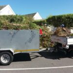 Snip-Cut's vehicle removing refuge from site during a landscaping project