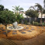 Landscaping job with a circular centerpiece and pavers surrounding